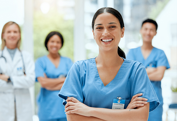 Smiling healthcare professionals standing together